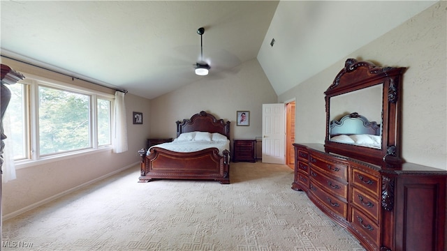 bedroom featuring lofted ceiling and light colored carpet