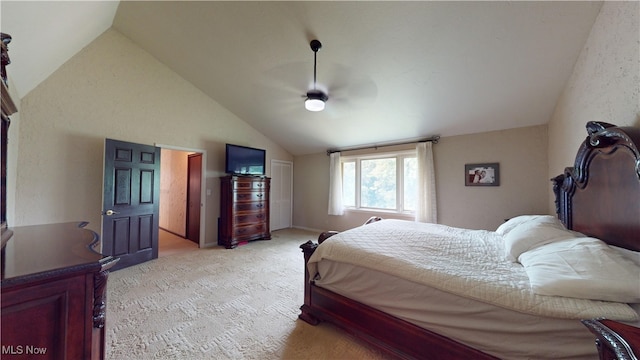 carpeted bedroom with vaulted ceiling and ceiling fan