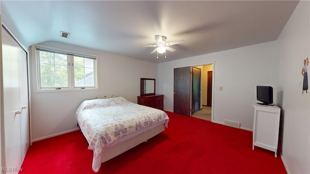 bedroom featuring lofted ceiling, carpet, and ceiling fan