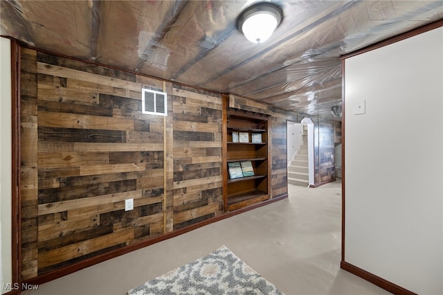 basement with wooden walls