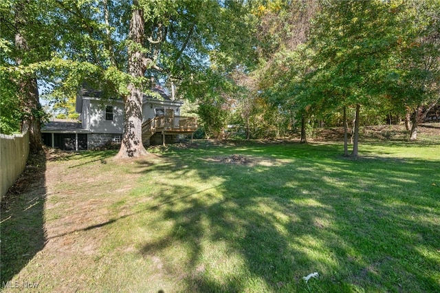 view of yard featuring a wooden deck