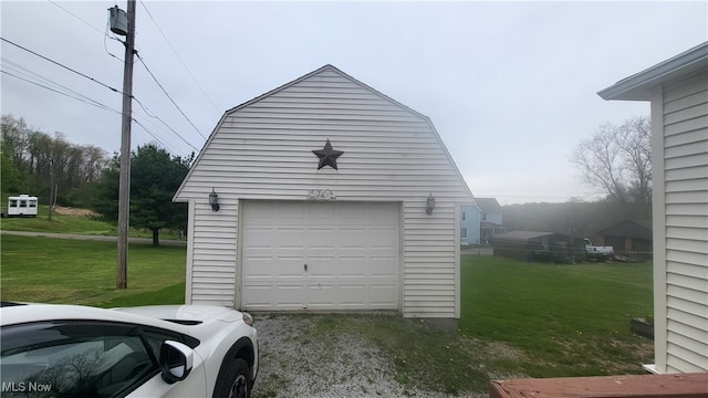 garage with a lawn