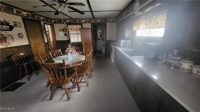 dining area with sink and ceiling fan