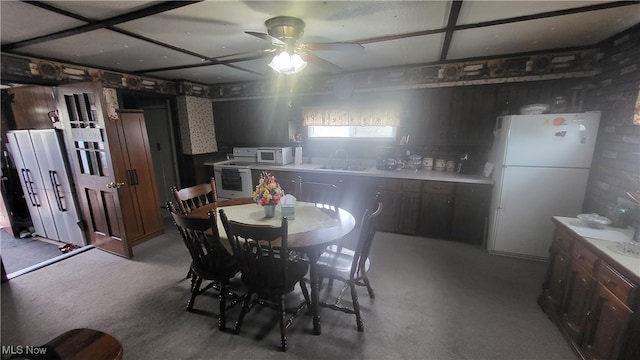 dining room with sink and ceiling fan