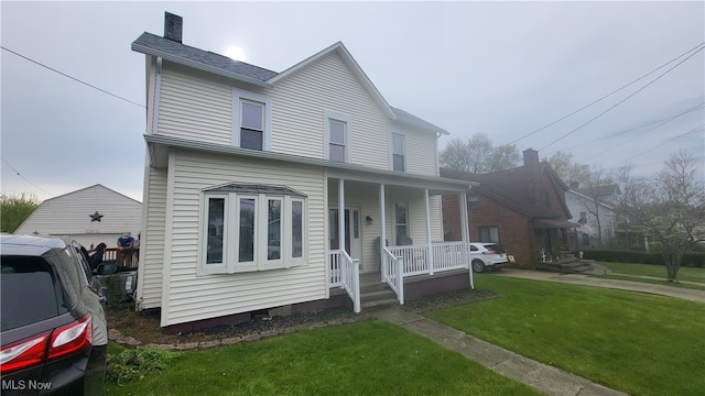 view of front of property featuring a porch and a front lawn