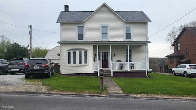 view of front of property featuring a porch and a front lawn