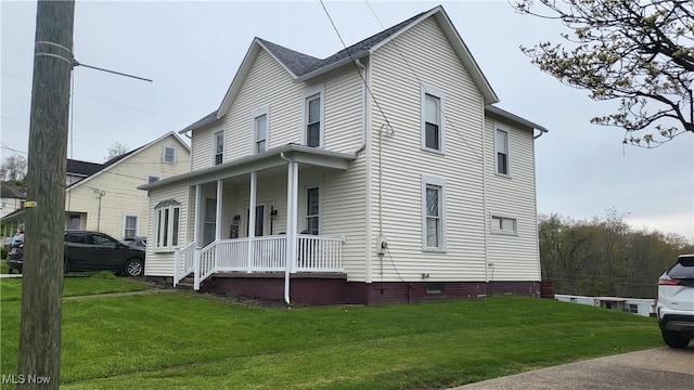 view of property exterior with covered porch and a yard