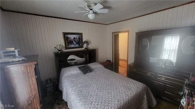 bedroom with ceiling fan and crown molding