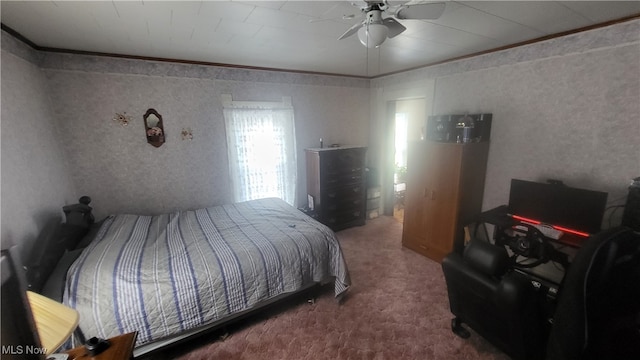 bedroom featuring crown molding, carpet flooring, and ceiling fan