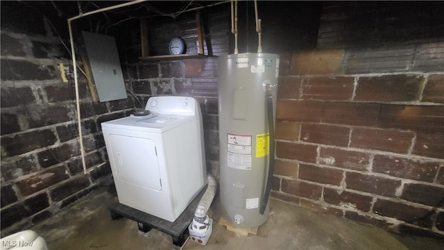 utility room featuring washer / dryer and water heater