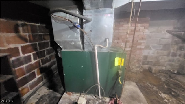 utility room with heating unit