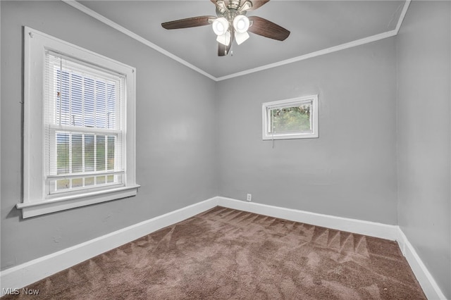 carpeted spare room featuring ceiling fan and ornamental molding