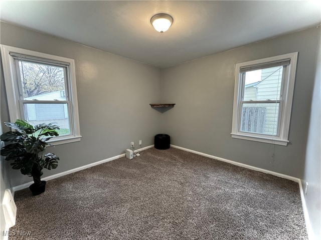 unfurnished room with carpet and a healthy amount of sunlight