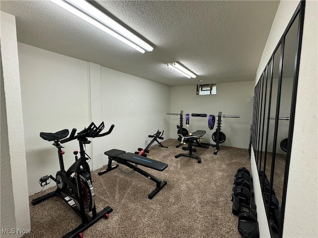 workout room with a textured ceiling