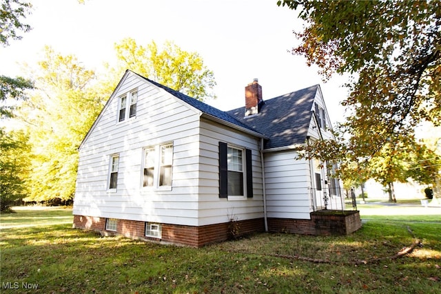 view of home's exterior with a lawn