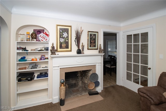 carpeted living room with built in features