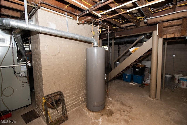 utility room featuring gas water heater and heating unit