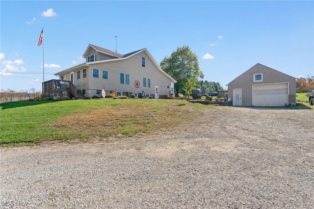 view of side of home with a garage, an outbuilding, and a lawn