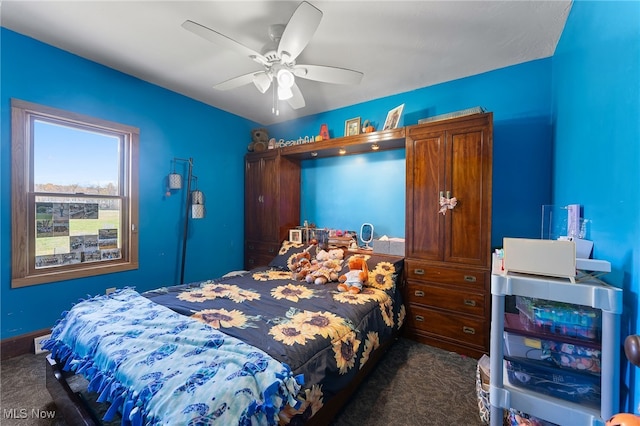 carpeted bedroom featuring ceiling fan