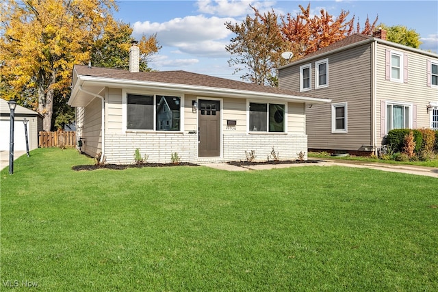 view of front of property with a front lawn