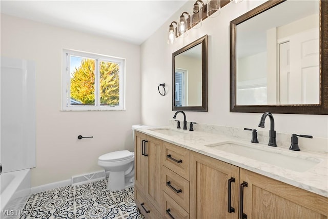 full bath with a sink, visible vents, toilet, and tile patterned floors