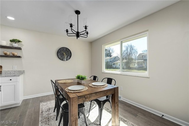 dining room featuring recessed lighting, a notable chandelier, baseboards, and dark wood-type flooring