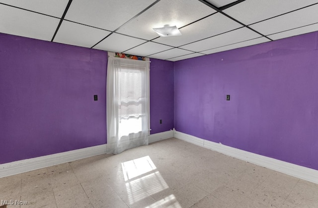 spare room featuring a paneled ceiling