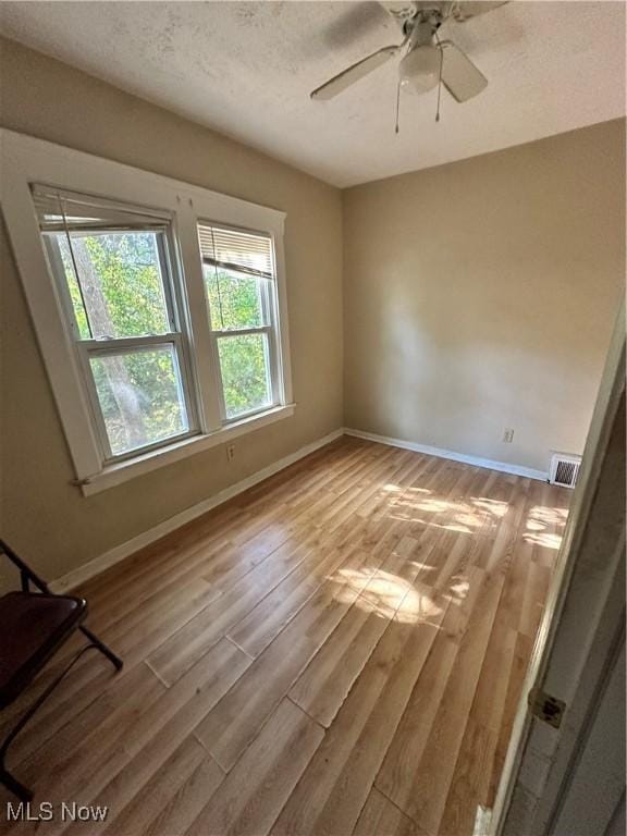 16512 Burnside Ave, Cleveland, OH 44110 - spare room featuring visible vents, baseboards, and wood finished floors