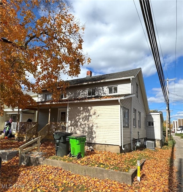 exterior space featuring central AC unit