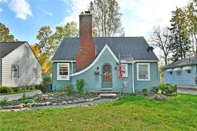 back of property featuring a yard