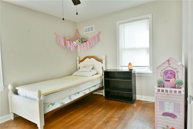 bedroom featuring wood-type flooring and ceiling fan