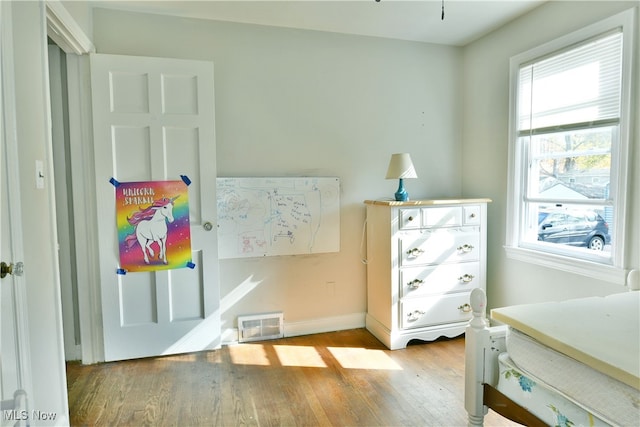 bedroom with light hardwood / wood-style flooring