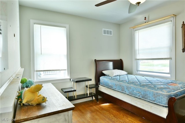 bedroom featuring wood-type flooring and ceiling fan