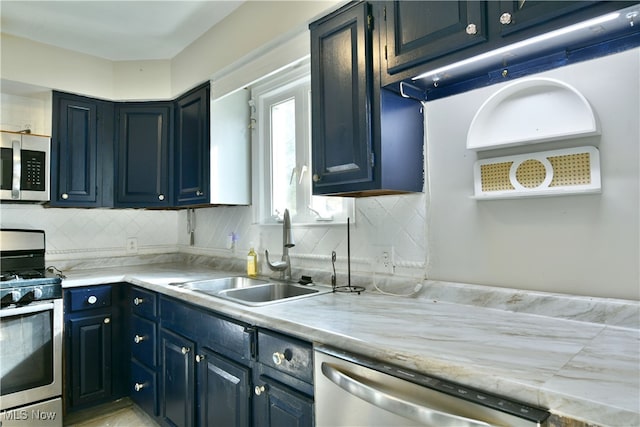 kitchen featuring sink, appliances with stainless steel finishes, and tasteful backsplash