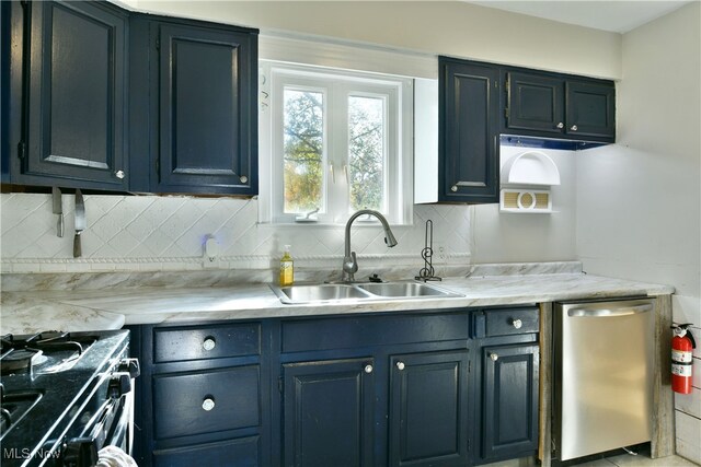 kitchen featuring black range with gas stovetop, dishwasher, tasteful backsplash, and sink