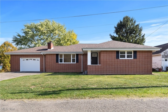 single story home with a garage and a front lawn