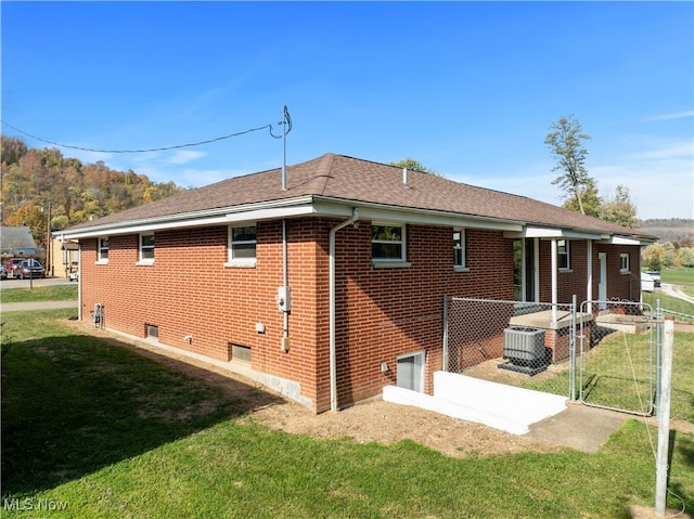 rear view of house with a lawn