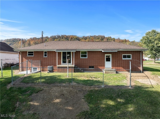 back of property featuring a yard