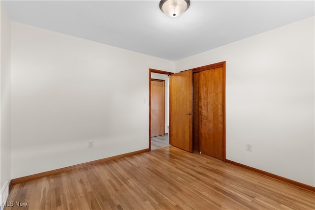 unfurnished room featuring light wood-type flooring