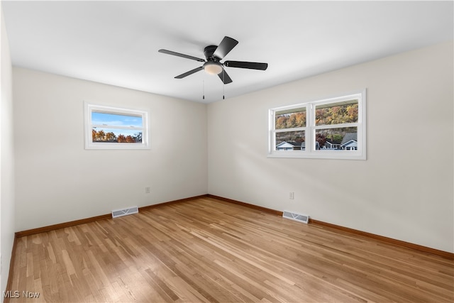 unfurnished room featuring light hardwood / wood-style floors and ceiling fan