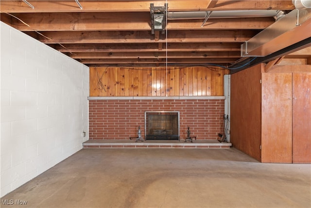 basement featuring a brick fireplace