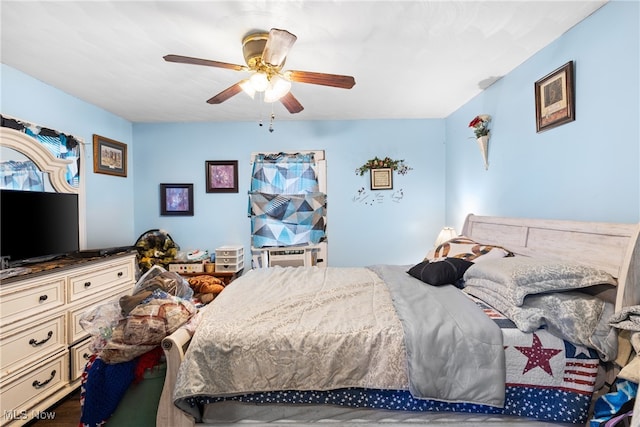 bedroom featuring ceiling fan and cooling unit