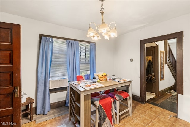 dining room featuring cooling unit and an inviting chandelier