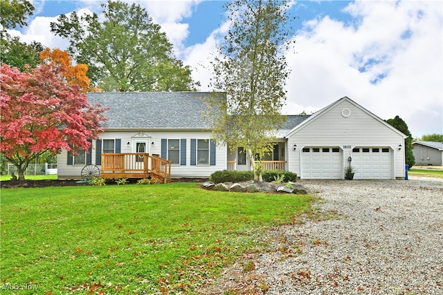 ranch-style house with a wooden deck, a garage, and a front lawn