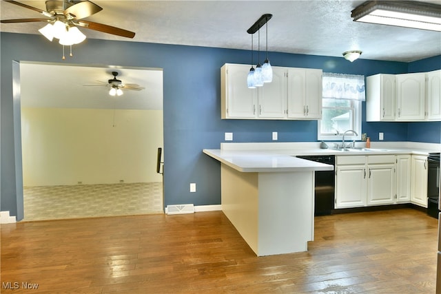 kitchen with white cabinetry, black appliances, and decorative light fixtures