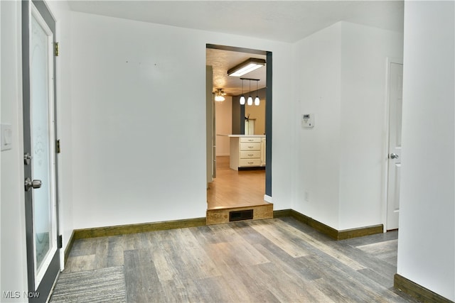 spare room featuring ceiling fan and dark hardwood / wood-style flooring