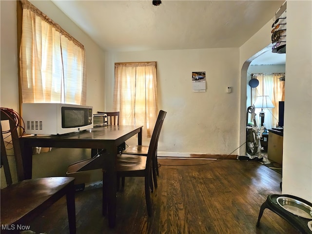 dining area with dark hardwood / wood-style floors