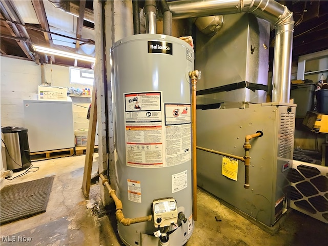 utility room featuring washer / clothes dryer and gas water heater