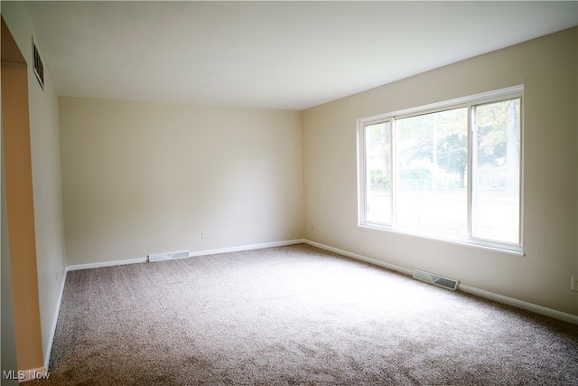 empty room with carpet flooring