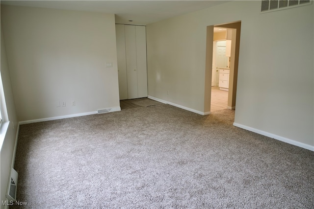 interior space featuring a closet and carpet